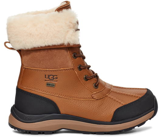 Tan waterproof ankle boot with fur lining and lace-up closure.