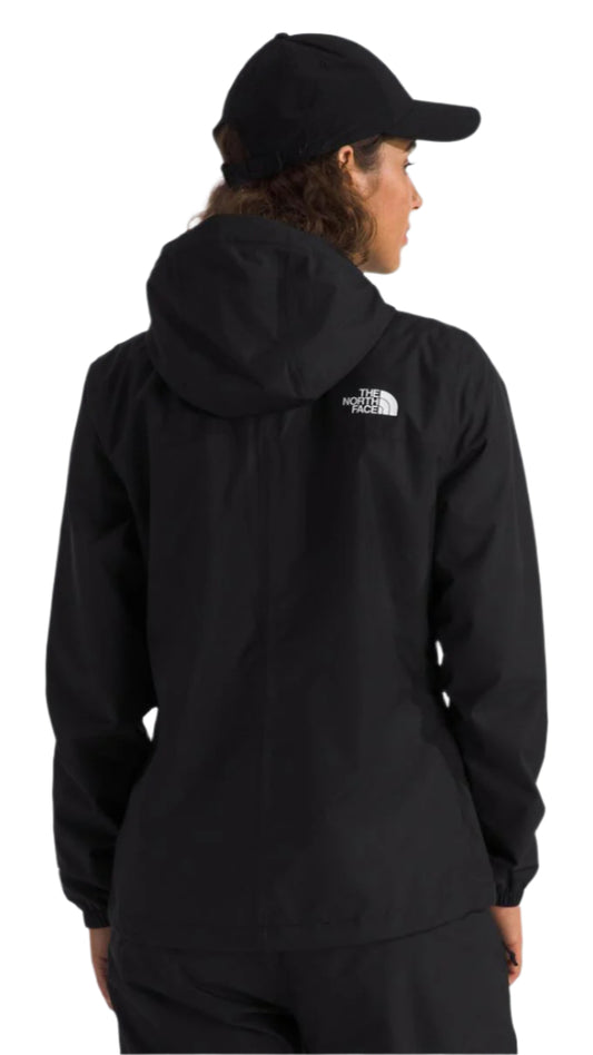 Black jacket with hood and black hat on person from back.