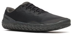 A black shoe with black laces and a textured sole.