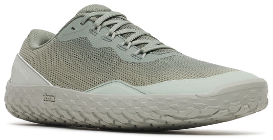 Low-top athletic shoe with a green mesh upper and a textured, light-colored sole.