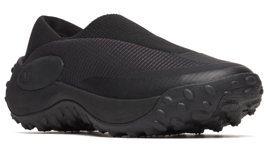 Black slip-on shoe with a thick treaded sole.