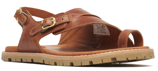 A brown sandal with a toe loop and an ankle strap with a buckle.