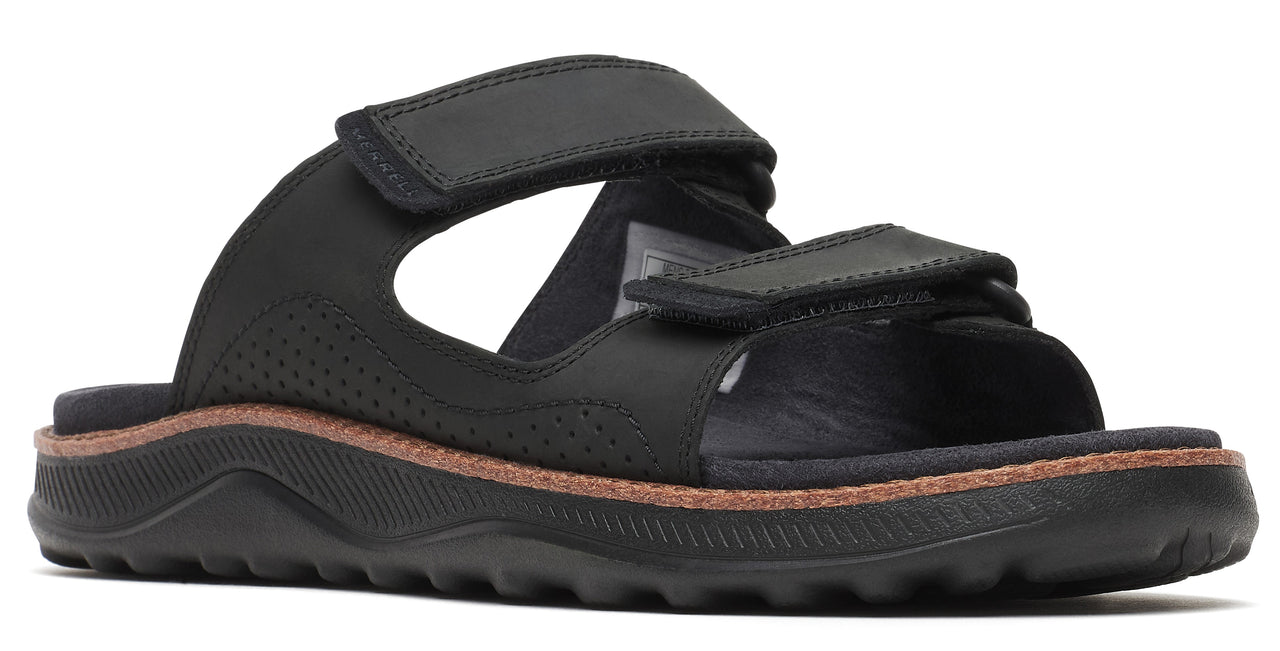 Black sandal with velcro straps and thick sole.