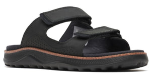 Black sandal with velcro straps and thick sole.