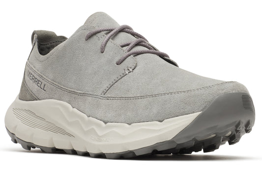 A gray suede shoe with gray laces and a thick white and gray sole.