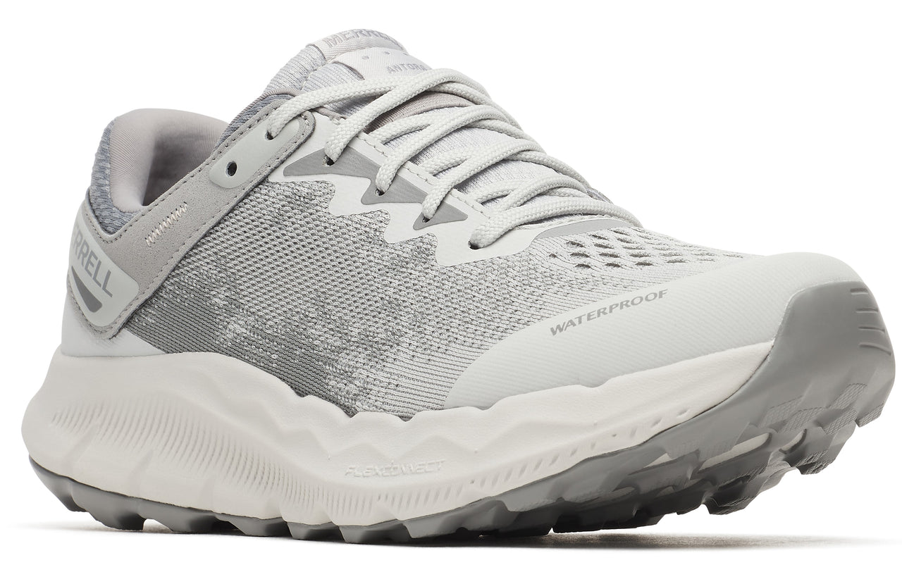 A grey and white athletic shoe with laces and a thick treaded sole, 'WATERPROOF' printed on the side.