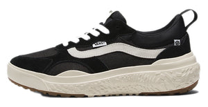 A low-top black sneaker with white laces, white side stripe, and beige textured sole.