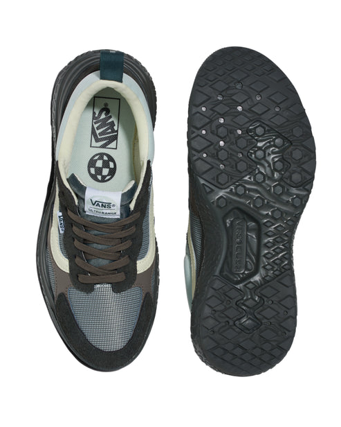 Two views of a gray, dark-green, and off-white athletic shoe with brown laces, cream inner lining, black sole, a dark-green loop at the heel, and the word "VANS" on the inner sole.