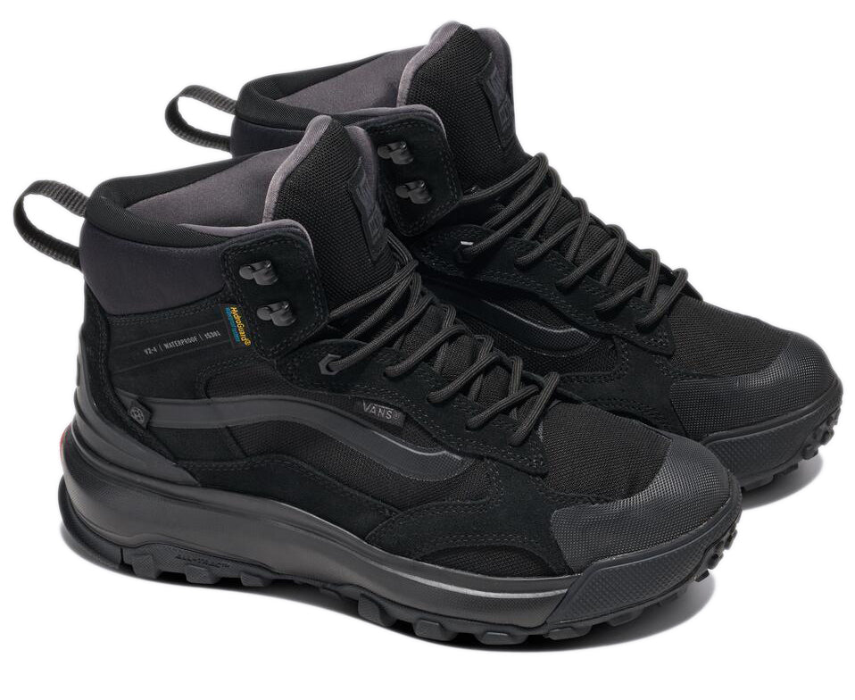Pair of black high top hiking shoes with lug soles and gray lining.