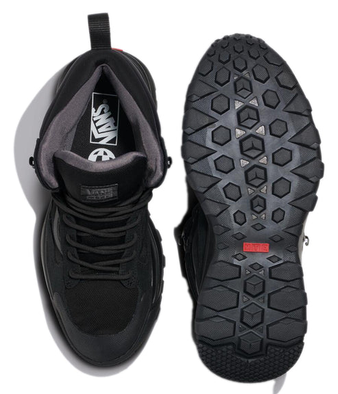 Two black lace-up high-top sneakers, one showing the interior with the word "VANS" and a circular logo, the other showing the patterned sole with a red rectangle.