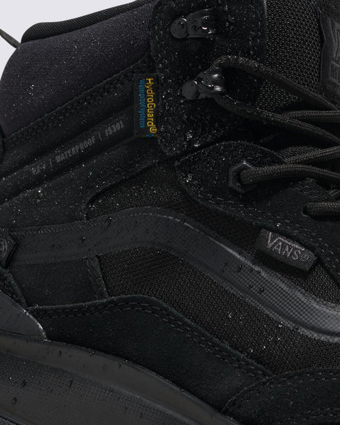 Close-up of a black hiking boot with "VANS" and "Hydroguard" visible.