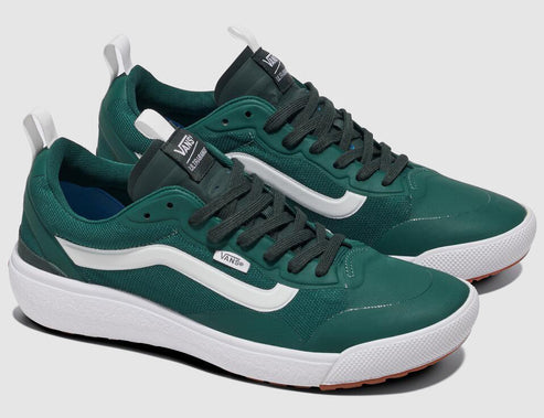 A pair of green sneakers with a white wave design on the sides, white soles, and dark green laces.