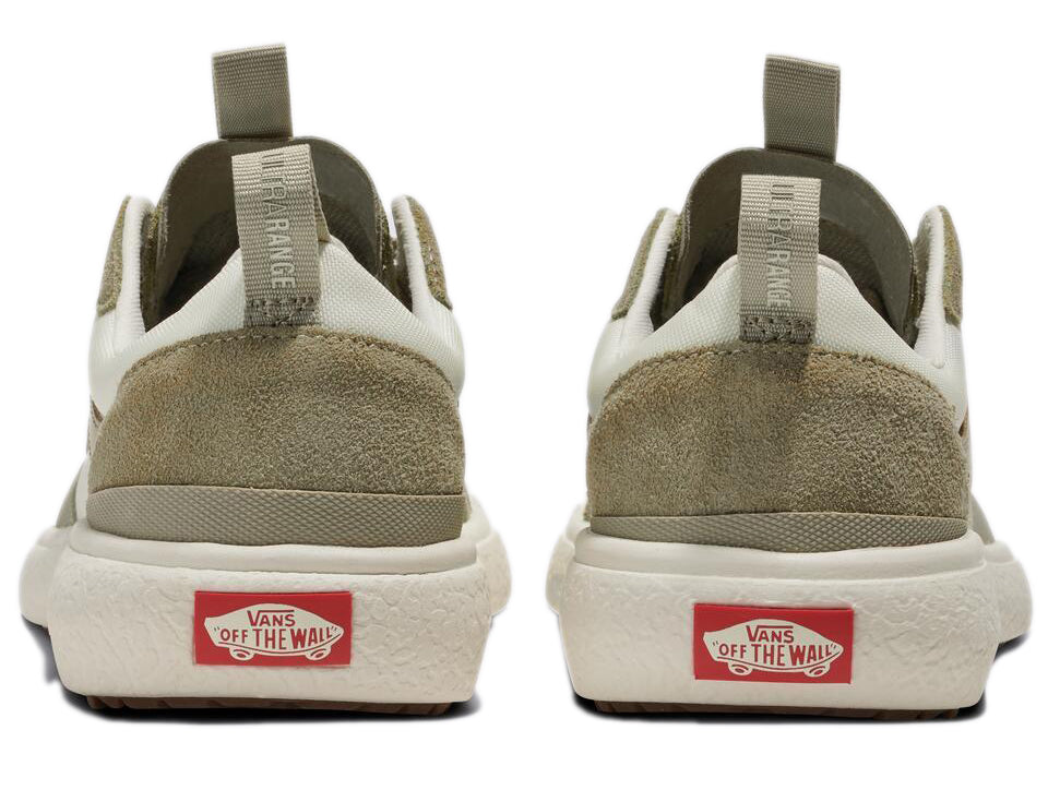 Rear view of two sneakers with “VANS OFF THE WALL” logo on the heel and a beige suede overlay.