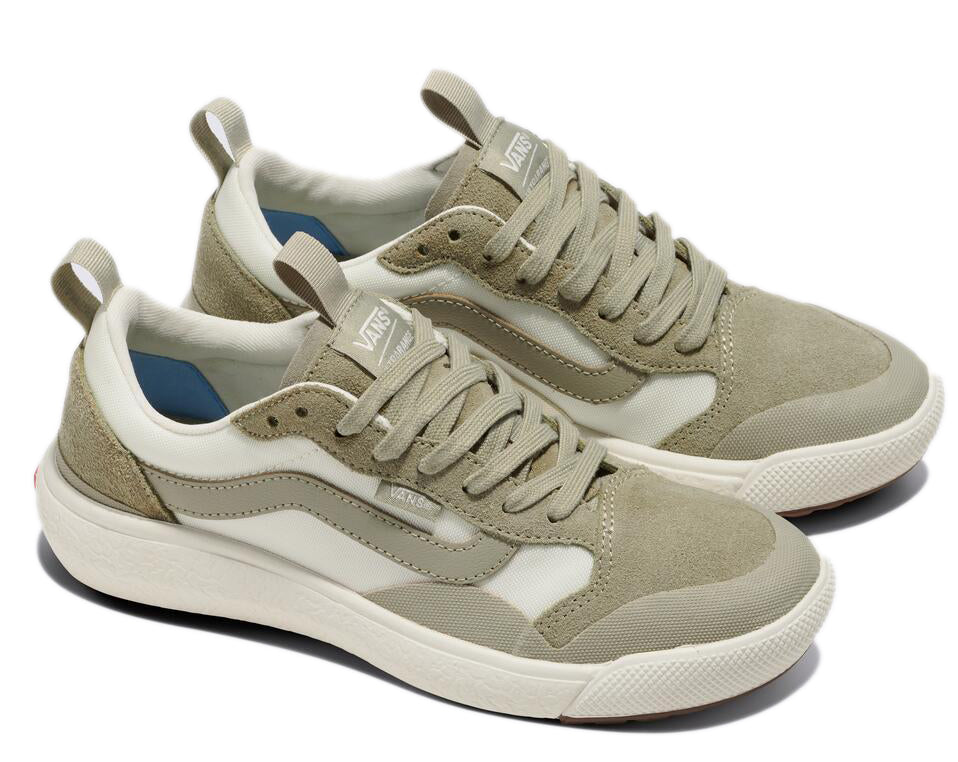 A pair of beige and white sneakers with laces and a pull tab on the heel.