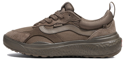 Profile view of a gray-toned sneaker with a textured sole and prominent side stripe.