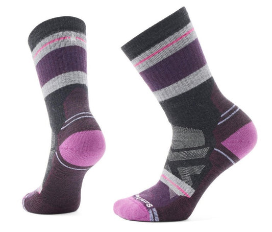 Two patterned crew socks with purple heel and toe, and horizontal stripes in gray, purple and pink.
