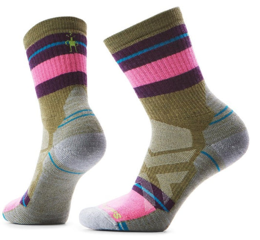Pair of crew socks with olive green, pink, purple, and light blue stripes on the upper portion and geometric grey design on the heel and sides.