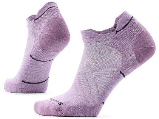 A pair of lavender-colored athletic ankle socks with black detail lines on the heels and ankles and the text Smartwool printed on the toes.