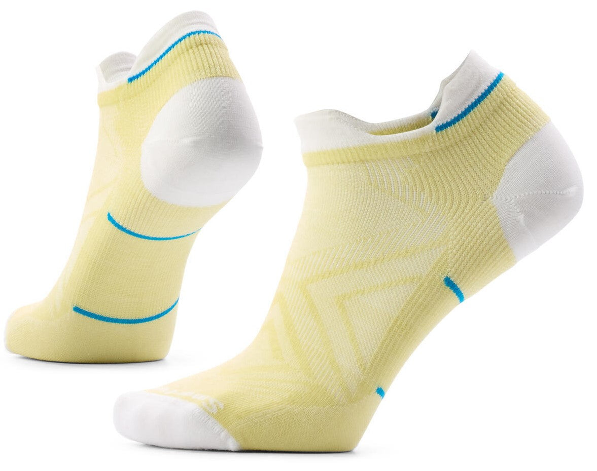 A pair of ankle-length athletic socks, primarily pale yellow with white heels, toes, and collar trim, featuring subtle blue accents along the cuff and mid-foot.