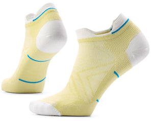 A pair of ankle-length athletic socks, primarily pale yellow with white heels, toes, and collar trim, featuring subtle blue accents along the cuff and mid-foot.