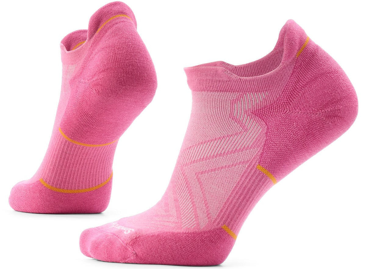 A pair of pink athletic ankle socks with textured, ribbed panels and subtle orange horizontal detailing at the arch and ankle.