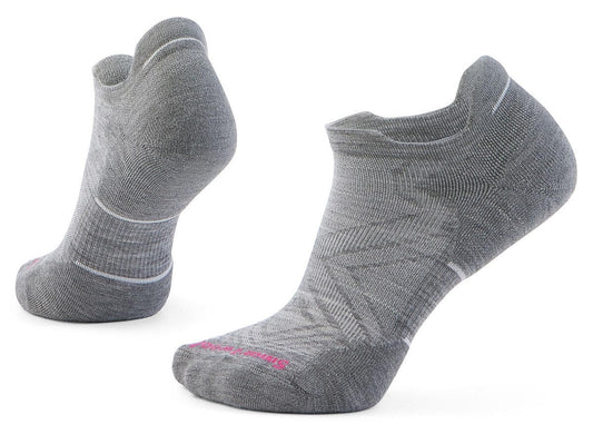 Two gray athletic socks; ankle high with pink accent at the toe.