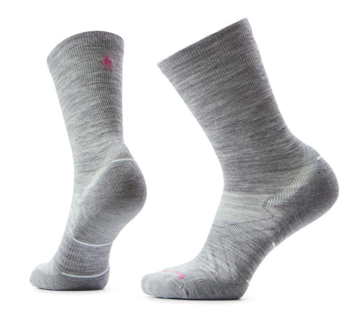 Two gray wool socks, one facing left and one facing right, with pink logo.