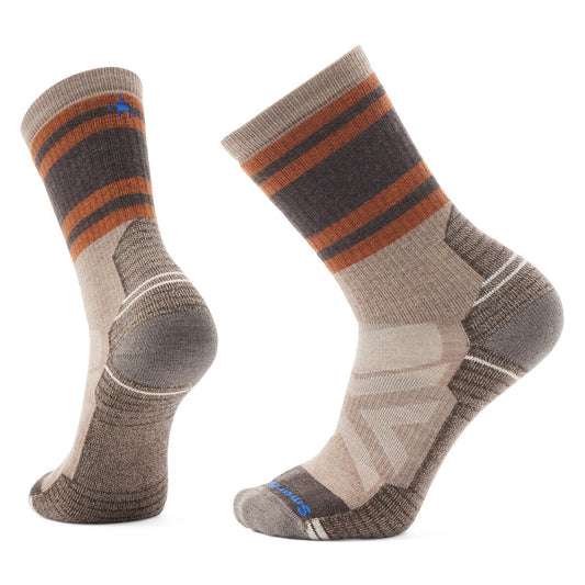 Two hiking socks with brown, tan and orange stripes.