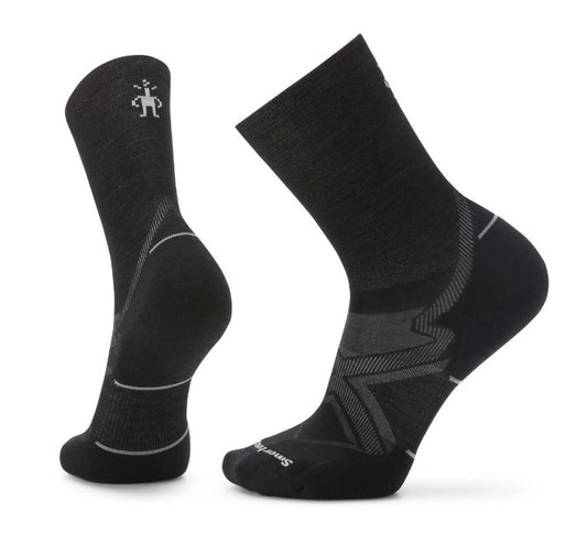 A pair of black crew socks, each featuring gray accent lines and toe and heel reinforcements, with the logo near the top of one sock.