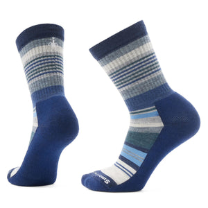 Two navy blue socks with multiple gray, white, and light blue stripes