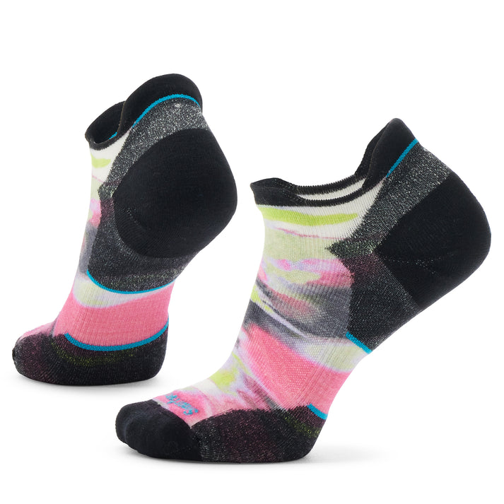 A pair of ankle socks featuring a pattern of pink, yellow, grey, and white with black toe and heel.