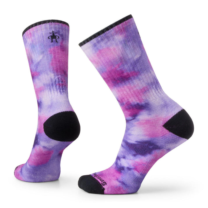 Pair of socks with a purple and pink tie dye pattern and black toe, heel, and top edge.