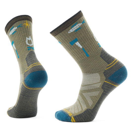 Two socks; khaki with camping graphics including an axe, fire, and feather.