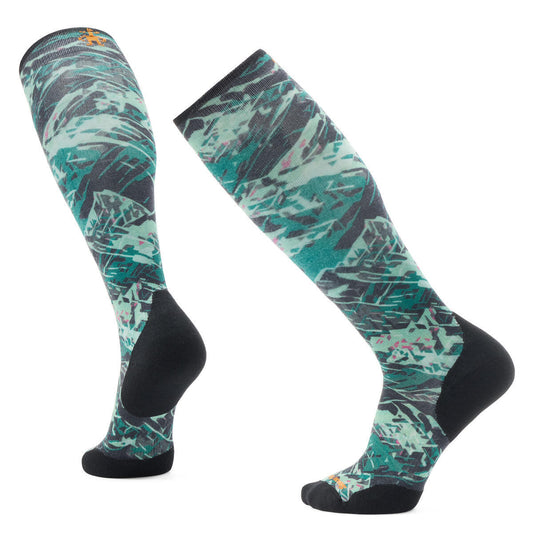 Two knee-high socks with abstract mountain print in green, teal, gray and black.