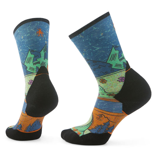 Two blue socks with mountain scene pattern and black heel and toe.