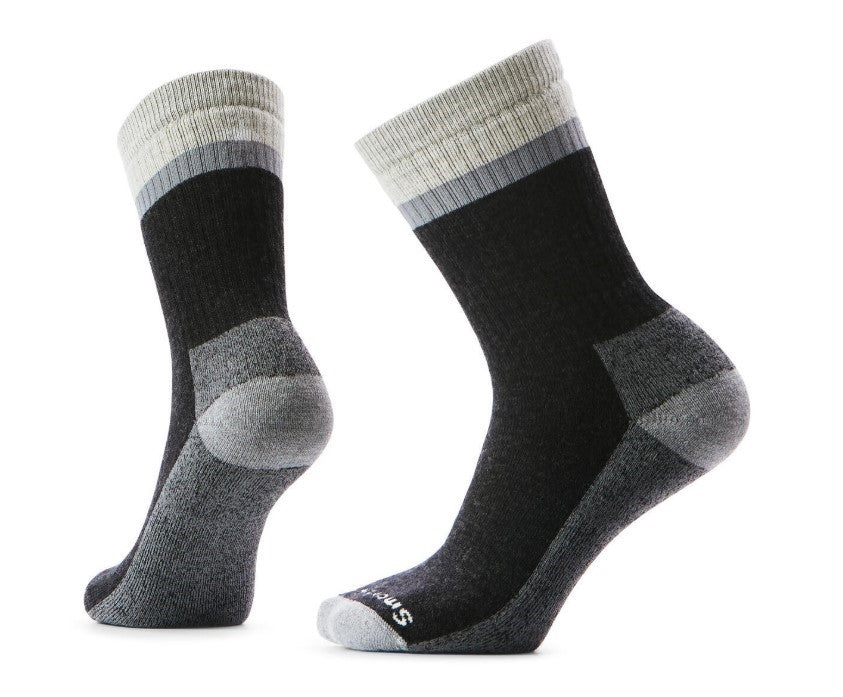 Two black socks with grey toes, heels and cuffs, on white background.