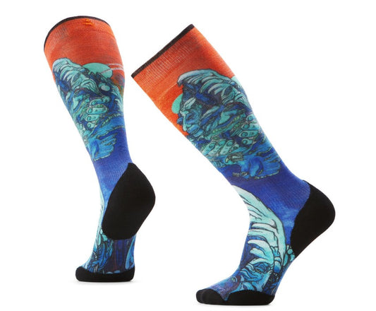 Knee-high socks with blue sea monster and orange sky design.
