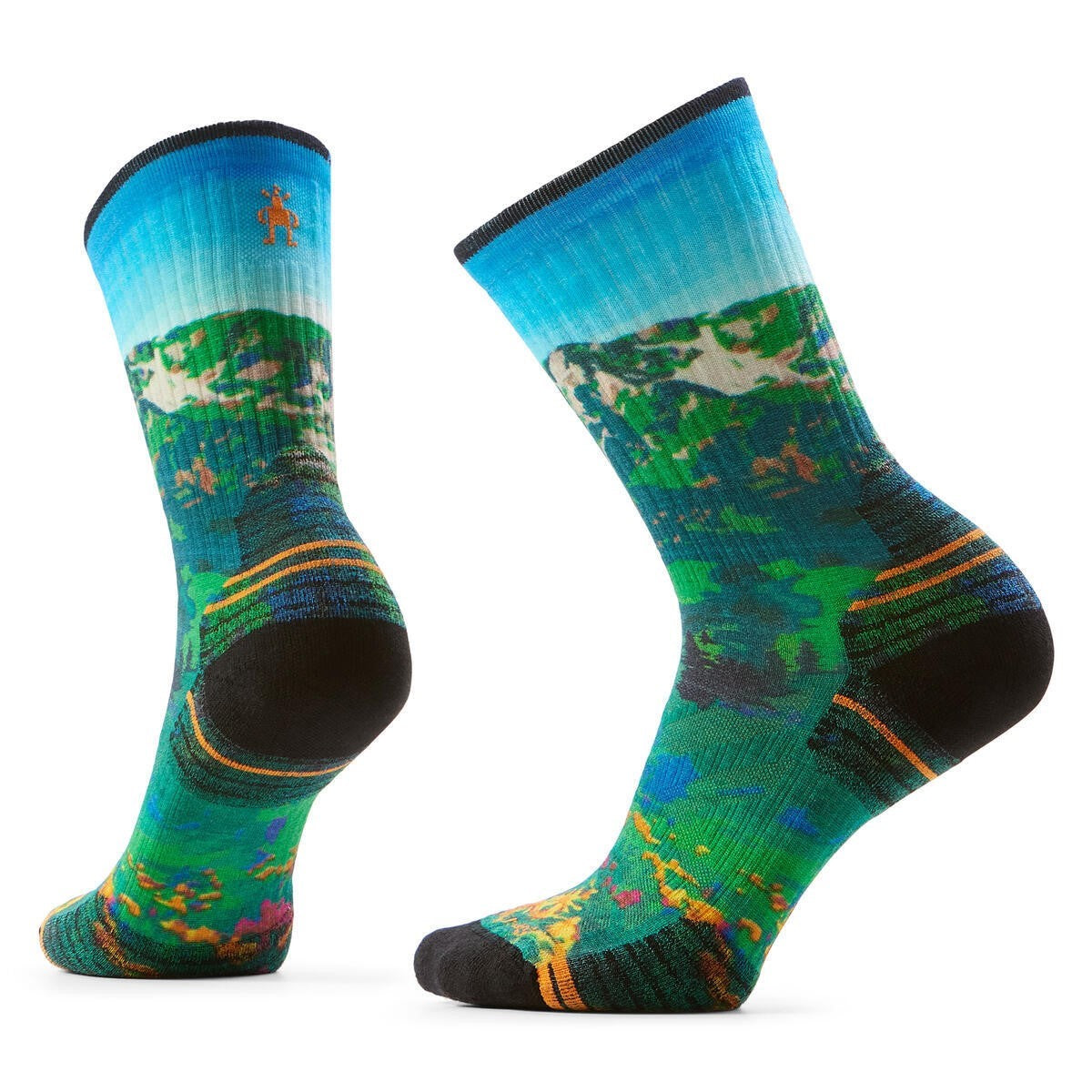 Two crew socks featuring a vivid landscape pattern in shades of green, blue, and yellow, with black heel and toe reinforcements.