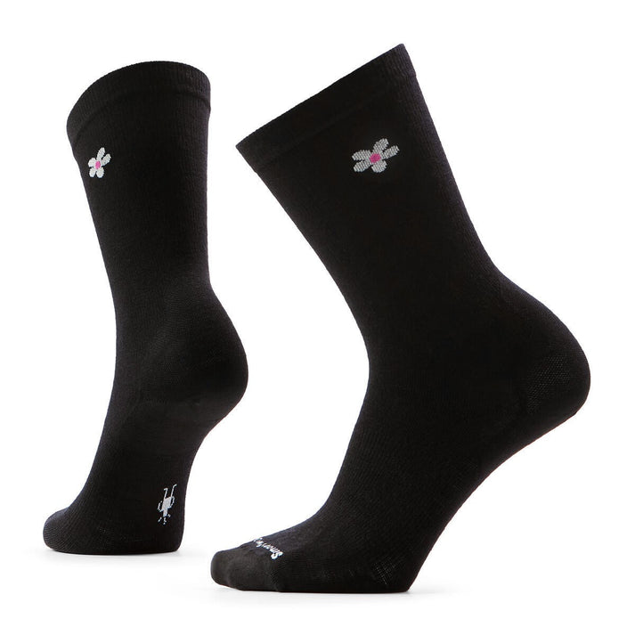 Pair of black socks with a small flower pattern.