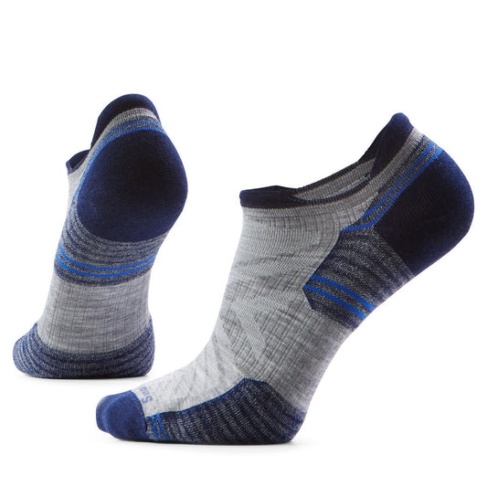 Two gray athletic socks with navy blue accents.