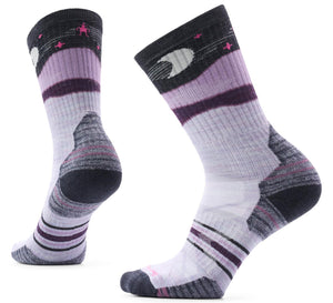 A pair of mid-calf athletic socks featuring a color palette of light purple, dark grey, and white, with a crescent moon and star pattern at the top cuff and ribbed texture along the midfoot and ankle.