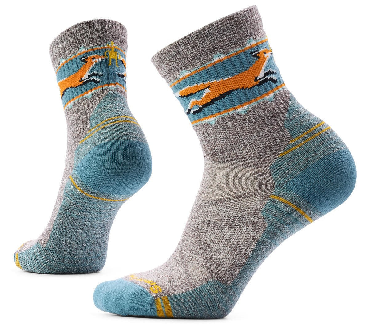 A pair of grey, blue, and yellow hiking socks featuring a graphic of an orange fox leaping across the cuff.