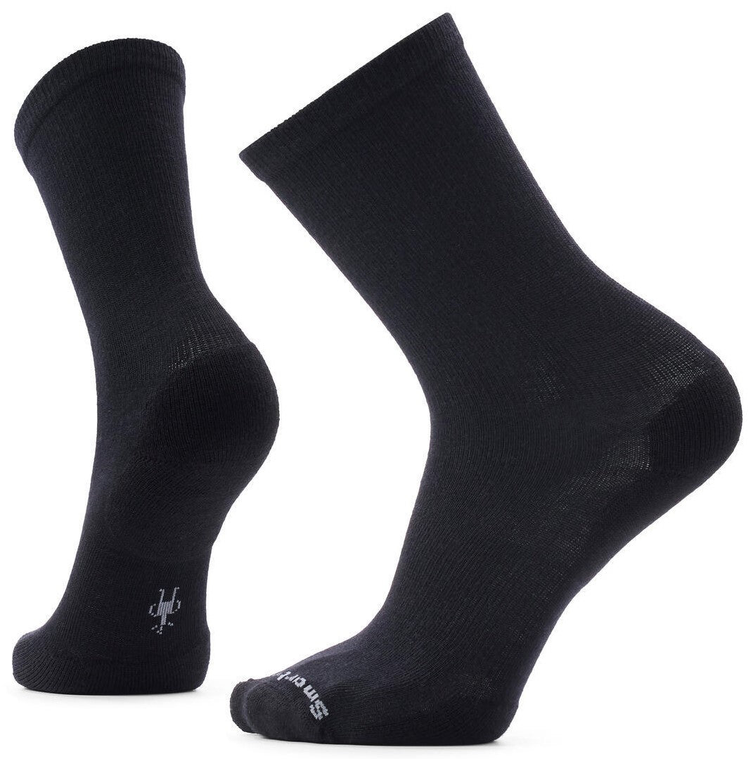 A pair of black mid-calf socks shown from two different angles, featuring a small grey Smartwool logo on the ankle and toe.