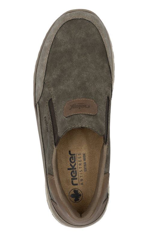 Top-down view of a slip-on shoe with mixed dark and light brown hues; features 'rieker ANTISTRESS EXTRA WEITE' text inside.