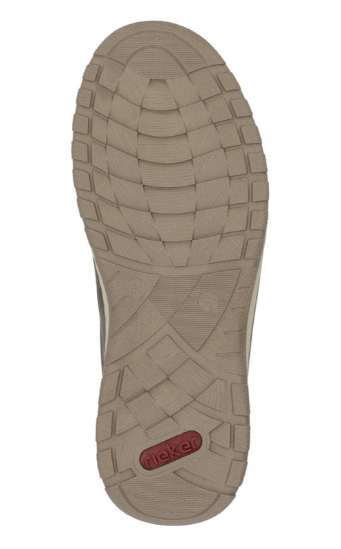 Shoe outsole with brand name 'Rieker' visible in red oval.