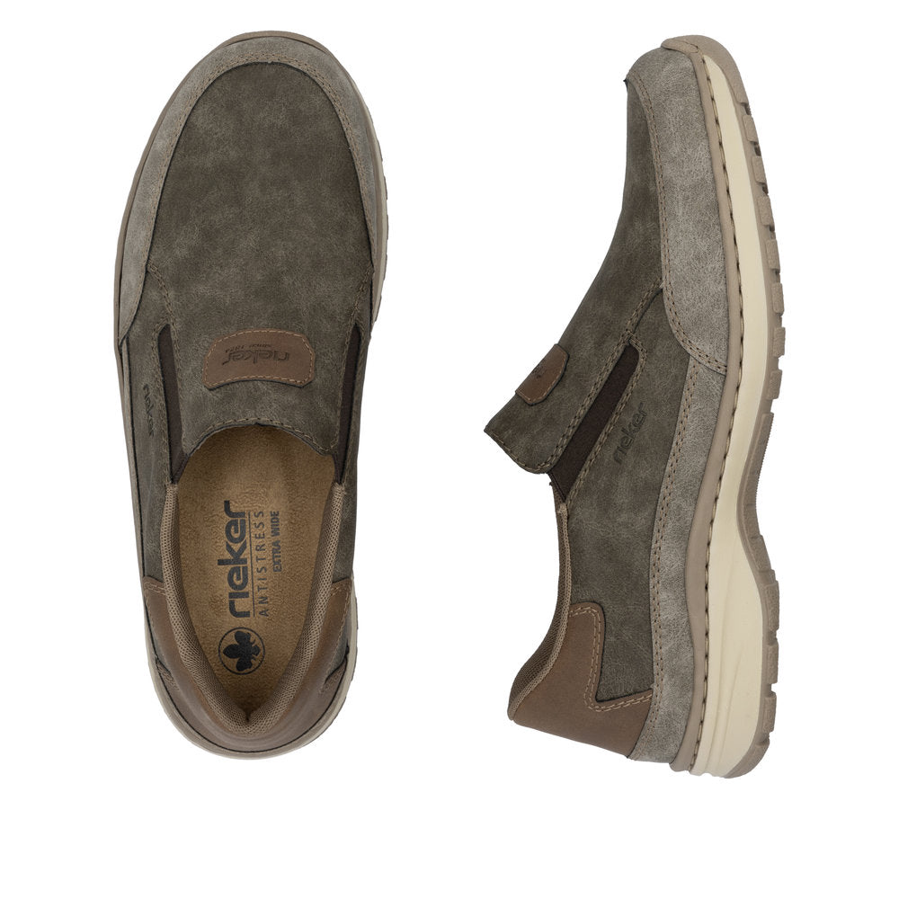 Two brown slip-on shoes; one from above showing insole, the other from side.