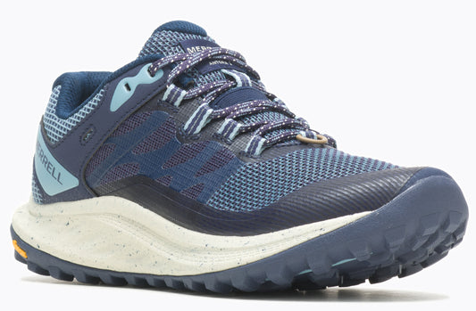 A low-cut blue trail running shoe with a patterned lace and a speckled off-white midsole.