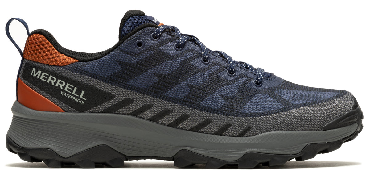 Side view of navy and grey trail running shoe with orange heel detail and "MERRELL WATERPROOF" label.