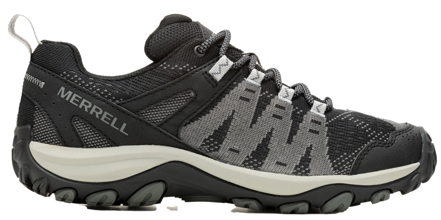 A low-rise hiking shoe with black and grey zig-zag patterned uppers, visible "MERRELL" branding on the side.