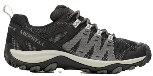 A low-rise hiking shoe with black and grey zig-zag patterned uppers, visible "MERRELL" branding on the side.